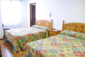 Ένα ή περισσότερα κρεβάτια σε δωμάτιο στο Posada La Bolera