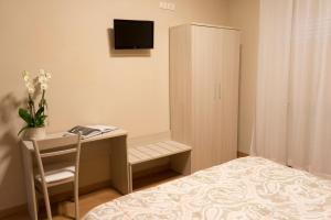 Postel nebo postele na pokoji v ubytování Hotel Cecco