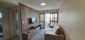 Sjónvarps- og/eða afþreyingartæki á Apartamentos 250m da Orla -Edifício Nugali- Castelo B Temporada