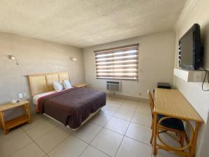 Postel nebo postele na pokoji v ubytování Hotel Paris + 17 fotografií