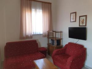 TV a/nebo společenská místnost v ubytování Happy 2Bedroom Apartments