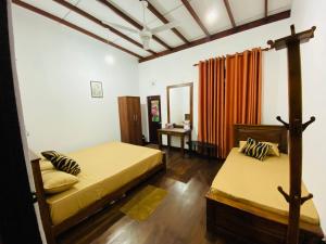 Postel nebo postele na pokoji v ubytování Uva Escape Holiday Bungalow