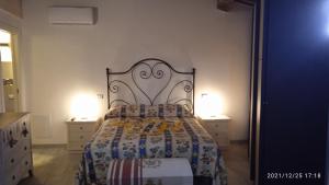 Posteľ alebo postele v izbe v ubytovaní La casa di Lisa