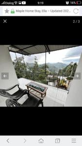 a picture of a balcony with a table and chairs at Maple Home Stay in Ella