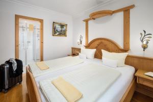 Postel nebo postele na pokoji v ubytování Hotel Preishof