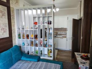 a living room with a large white cabinet with medicines at Delux Apartments Cote dAgur Burgas in Burgas City