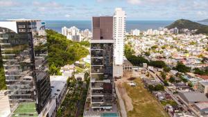 an aerial view of a city with buildings at Hilton Garden Inn Praia Brava in Itajaí