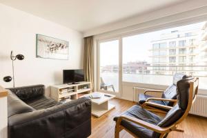 Posezení v ubytování Gezellig appartement aan Oostduinkerkse strand