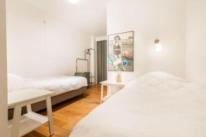 Postel nebo postele na pokoji v ubytování Gezellig appartement aan Oostduinkerkse strand