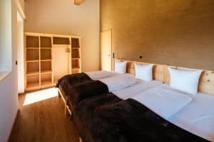 En eller flere senge i et værelse på Alpenpanorama Konzett