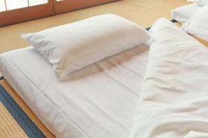Łóżko lub łóżka w pokoju w obiekcie Kouya - Vacation STAY 70479v