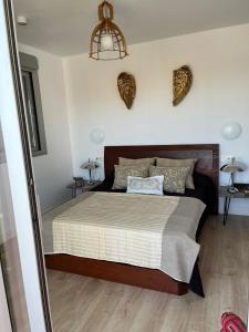 Postel nebo postele na pokoji v ubytování PUSHE Playa Granada Beach&Golf 4