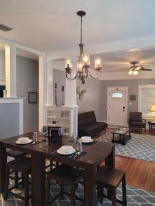 a living room with a dining table and a couch at Modern Two Bedroom Home in Lakeland