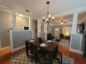 a dining room and living room with a table and chairs at Modern Two Bedroom Home in Lakeland