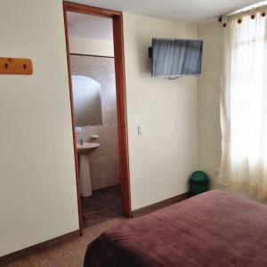 Ein Bett oder Betten in einem Zimmer der Unterkunft Hotel Susagua
