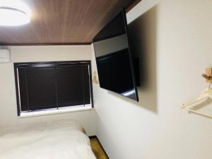 A television and/or entertainment centre at Maisonity Suizenji - Vacation STAY 10562v