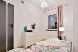 Posteľ alebo postele v izbe v ubytovaní Nowoczesne Apartamenty typu Superior - Bulwary Rabka Zdrój - Balia - Blisko Park Zdrojowy