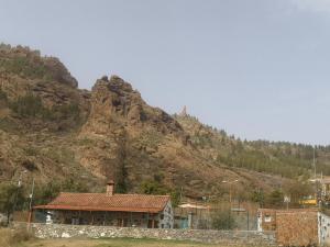 a house in front of a mountain at Casa Naranjo in Ayacata