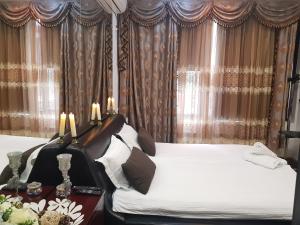 Ένα ή περισσότερα κρεβάτια σε δωμάτιο στο Ground Floor Mega Mall National Arena Monza +1 φωτογραφίες