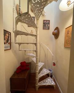 a stairwell with a spiral staircase in a home at Villa la Moresca Relais de Charme BeB Adults only in Montecatini Terme