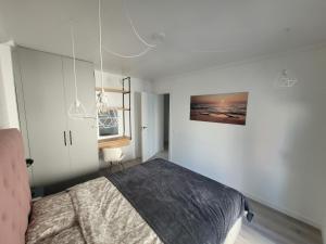 A bed or beds in a room at Apartamentos SABINILLAS