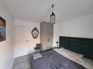 Кровать или кровати в номере Apartamentos SABINILLAS