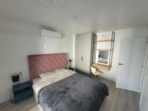 A bed or beds in a room at Apartamentos SABINILLAS