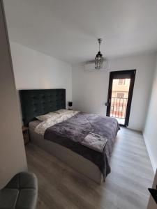 A bed or beds in a room at Apartamentos SABINILLAS