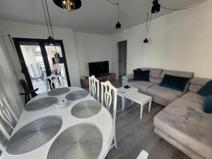 A seating area at Apartamentos SABINILLAS