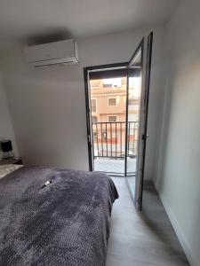 A bed or beds in a room at Apartamentos SABINILLAS