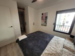 A bed or beds in a room at Apartamentos SABINILLAS