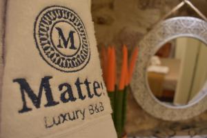 Certifikát, hodnocení, plakát nebo jiný dokument vystavený v ubytování MATTEI LUXURY B&B