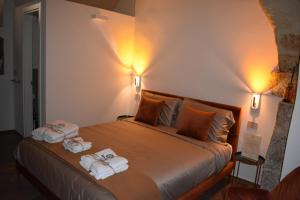 Postel nebo postele na pokoji v ubytování MATTEI LUXURY B&B