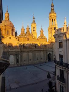 a large building with two towers on top of it at El BALCÓN de PILAR in Zaragoza