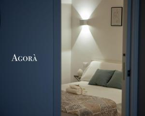 Postel nebo postele na pokoji v ubytování Agorà Home