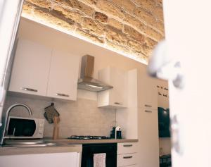 Kuchyň nebo kuchyňský kout v ubytování Agorà Home + 37 fotografií