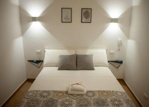 Postel nebo postele na pokoji v ubytování Agorà Home