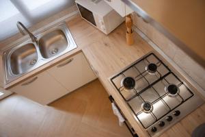 Kuchyň nebo kuchyňský kout v ubytování Agorà Home