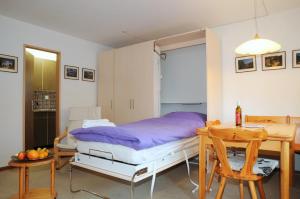 Postel nebo postele na pokoji v ubytování Alpenhaus Bettmeralp