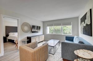 a living room with a couch and a bed at 365 Ocean in Boca Raton