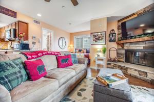 a living room with a couch and a fireplace at Gatlinburg Summit Condo #6208 in Gatlinburg