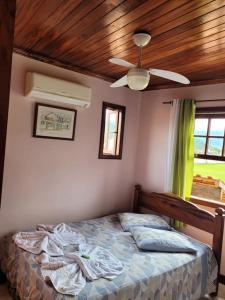 Ένα ή περισσότερα κρεβάτια σε δωμάτιο στο Casa em Paraty a 7 min. do Centro histórico