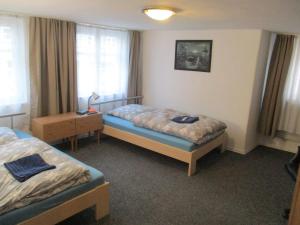 Säng eller sängar i ett rum på Ferienzimmer Monteurzimmer Stadtmitte Nördlingen