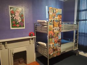 Postel nebo postele na pokoji v ubytování Gaslamp Hostel