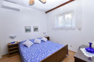 Postel nebo postele na pokoji v ubytování Apartments 2M