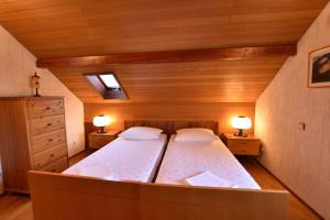 Postel nebo postele na pokoji v ubytování Apartments 2M
