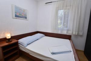 Postel nebo postele na pokoji v ubytování Apartments 2M