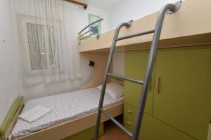 Postel nebo postele na pokoji v ubytování Apartments 2M