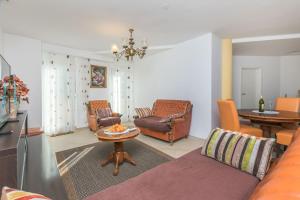 Posezení v ubytování Apartments and Room Excelsior