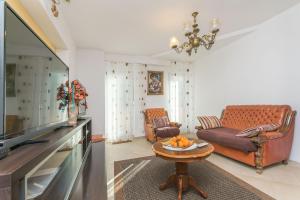 Posezení v ubytování Apartments and Room Excelsior